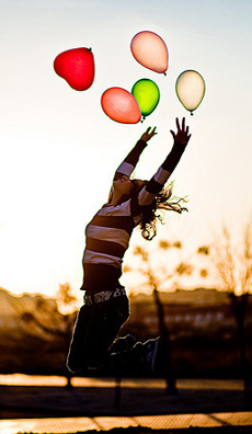 Lady holding baloons free