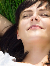 Lady relaxing on grass